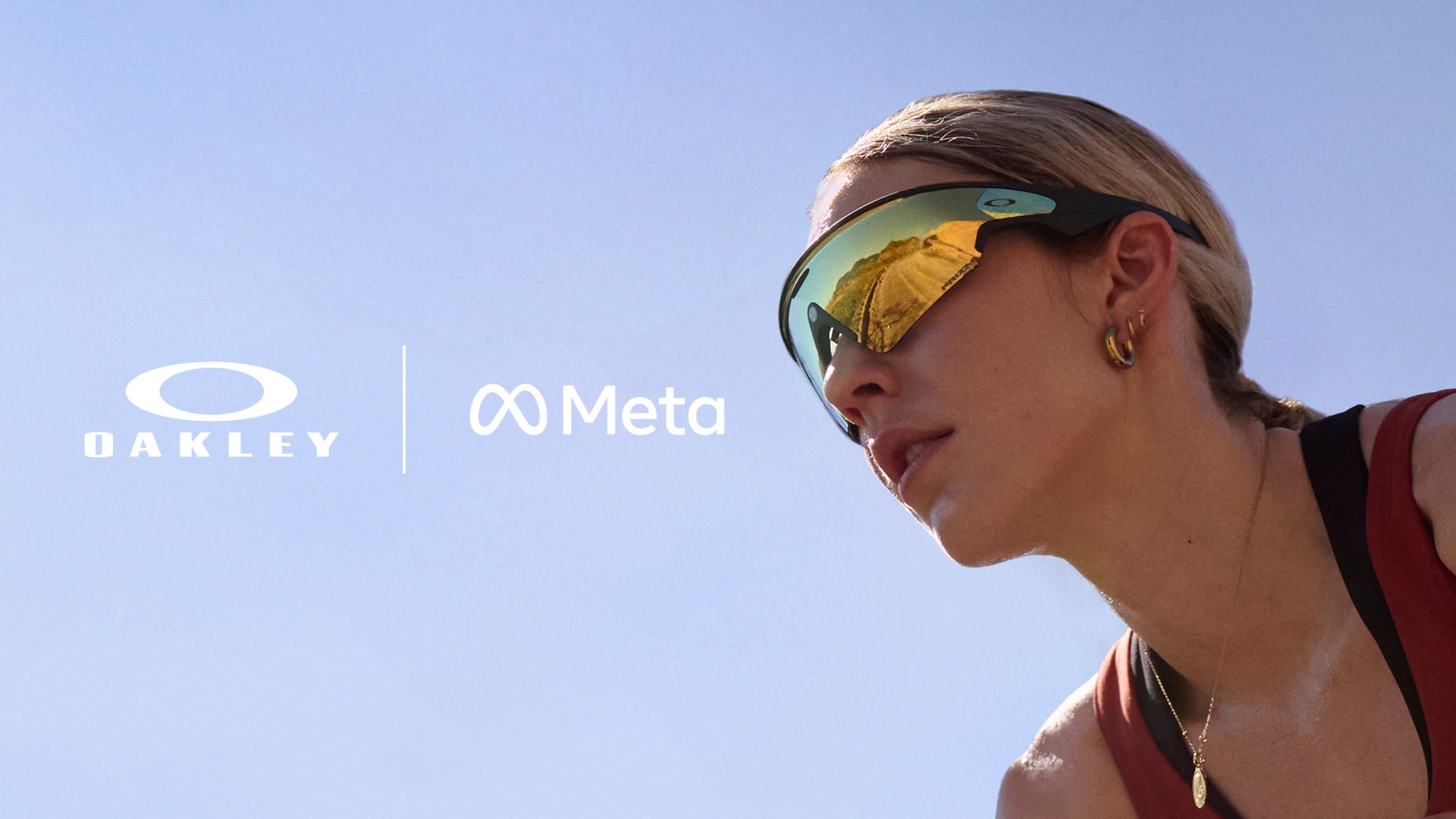 A close-up view of clear-lens Oakley Meta Vanguard smart glasses, with a focus on the camera and frame design.