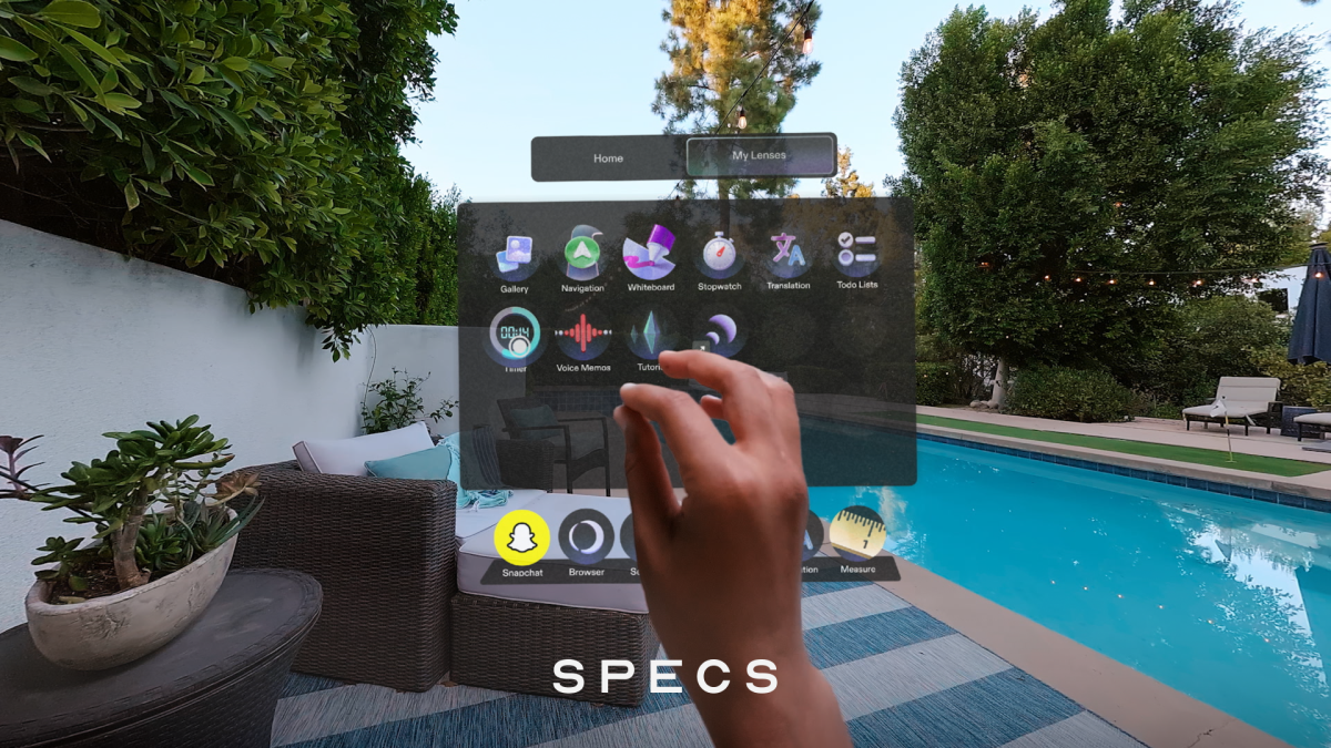 A digital rendering of the user interface on Snap Specs smart glasses, showing a home menu with app icons.